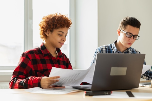 Business valuation charts and financial reports on a desk