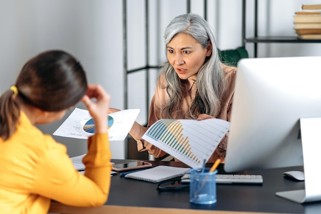Financial professionals reviewing M&A transaction documents